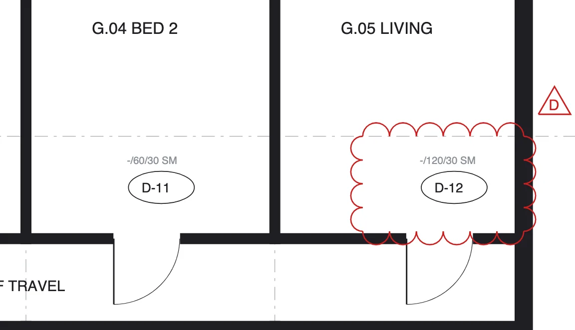 A revision cloud around a changed door on a floor plan